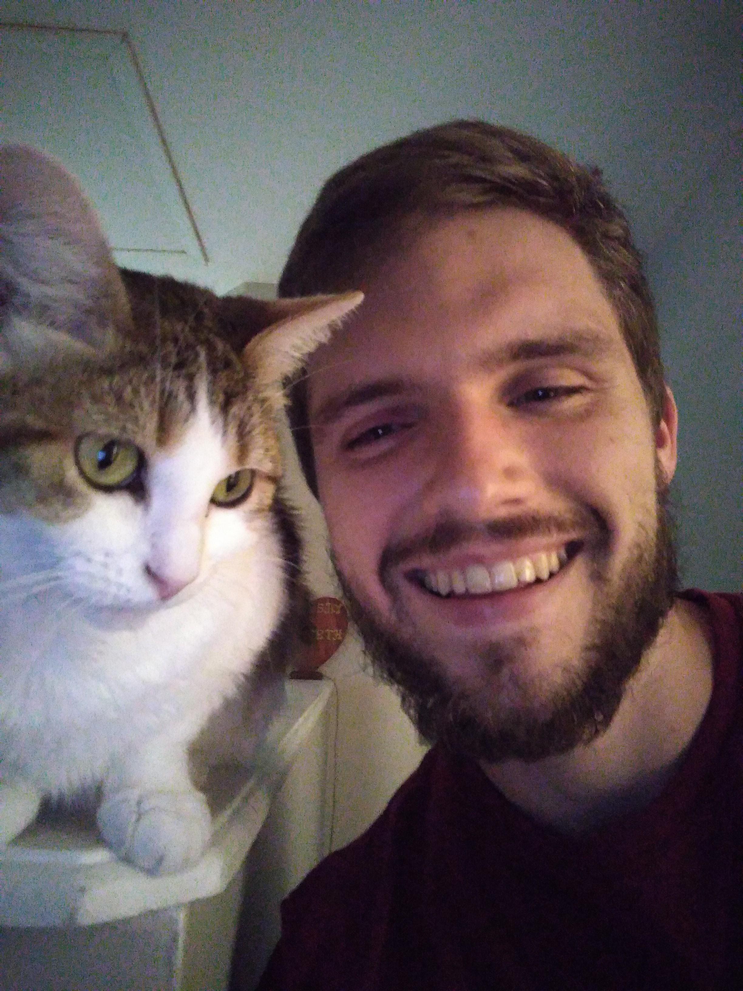 Picture of Kenneth with his cat Phoebe